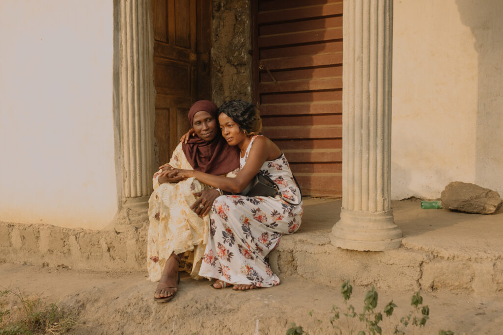 Sierra Leoneans repatriated from the Middle East Embracing. Photo Credit: Aline Deschamps